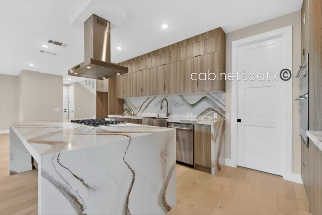 A home where every detail speaks luxury ✨

This full house kitchen and bath designed by Cabinetto showcases the beauty of frameless cabinetry, clean lines, seamless flow, and elevated craftsmanship throughout the kitchen and baths.

Featuring stunning @cambriasurfaces “Brittanicca Gold” Warm countertops with mitred edges, full-height backsplashes, and perfectly vein-matched waterfall details that make a bold, timeless statement.

Rich walnut tones warm the space, flowing from the kitchen into the bathrooms with a statement island at the center. Paired with sleek @hafeleamerica edge pulls and elegant @ruvati sinks, every detail is thoughtfully chosen.

Designed for function, built for beauty, this is what a dream remodel looks like.

#kitchengoals #kitchenremodel #cabinetto #instagram #austinremodel