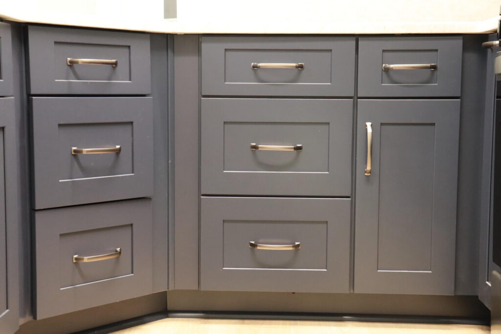 RTA Blue Shaker base cabinets, RTA White Shaker uppers in the kitchen