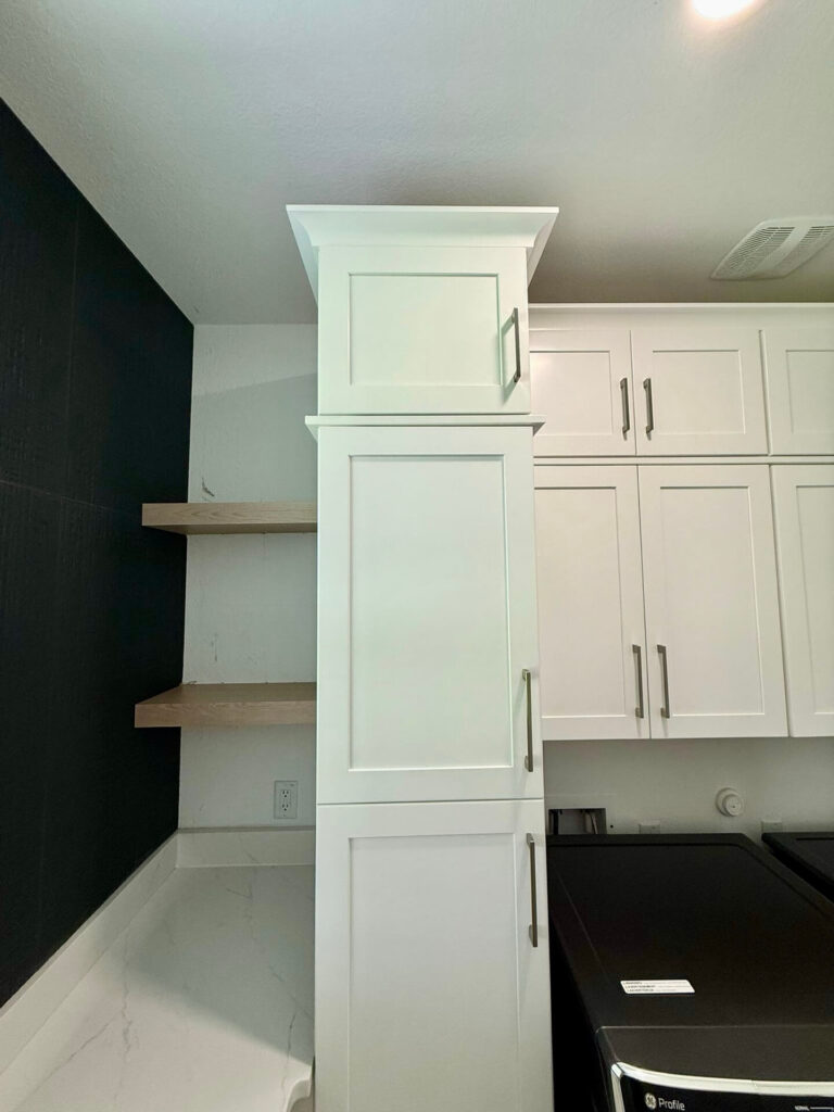 Fabuwood Graphite Galaxy on the main kitchen run, Durasupreme Black Paint on select pieces