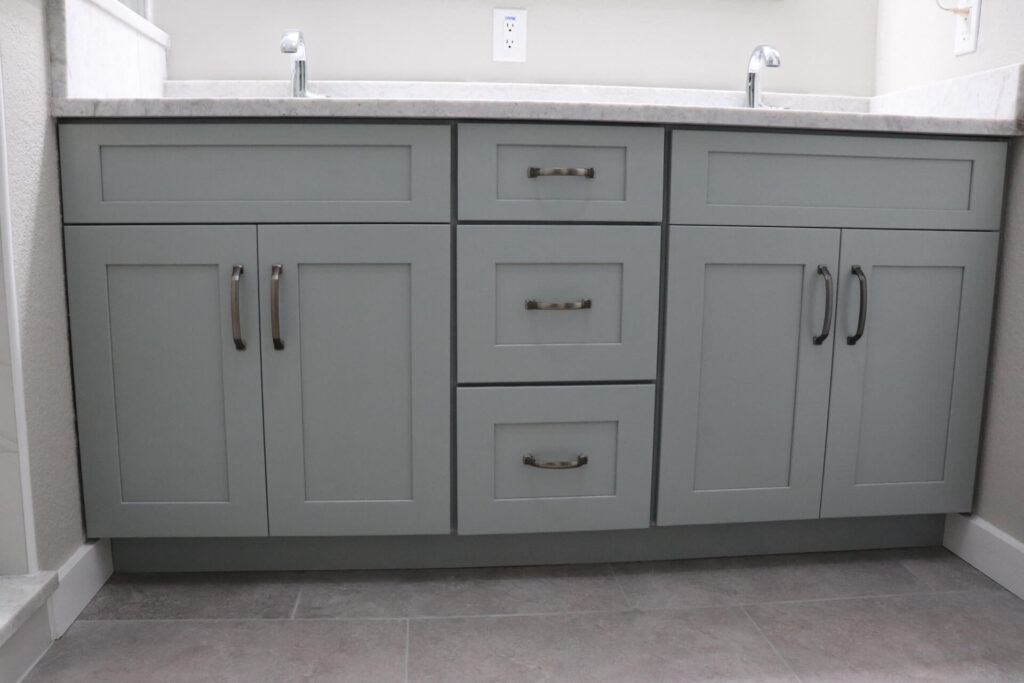 RTA Blue Shaker base cabinets, RTA White Shaker uppers in the kitchen