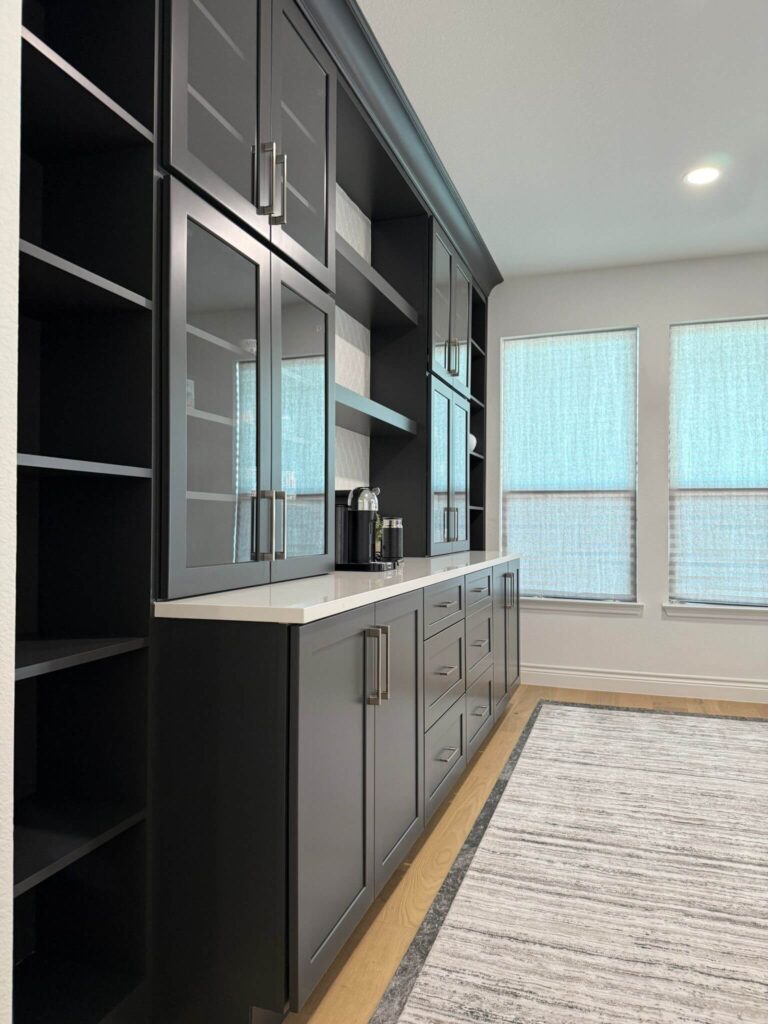 Fabuwood Graphite Galaxy on the main kitchen run, Durasupreme Black Paint on select pieces