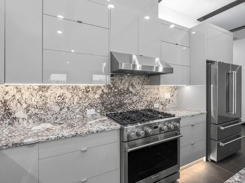 Frameless cabinetry in white glossy finish