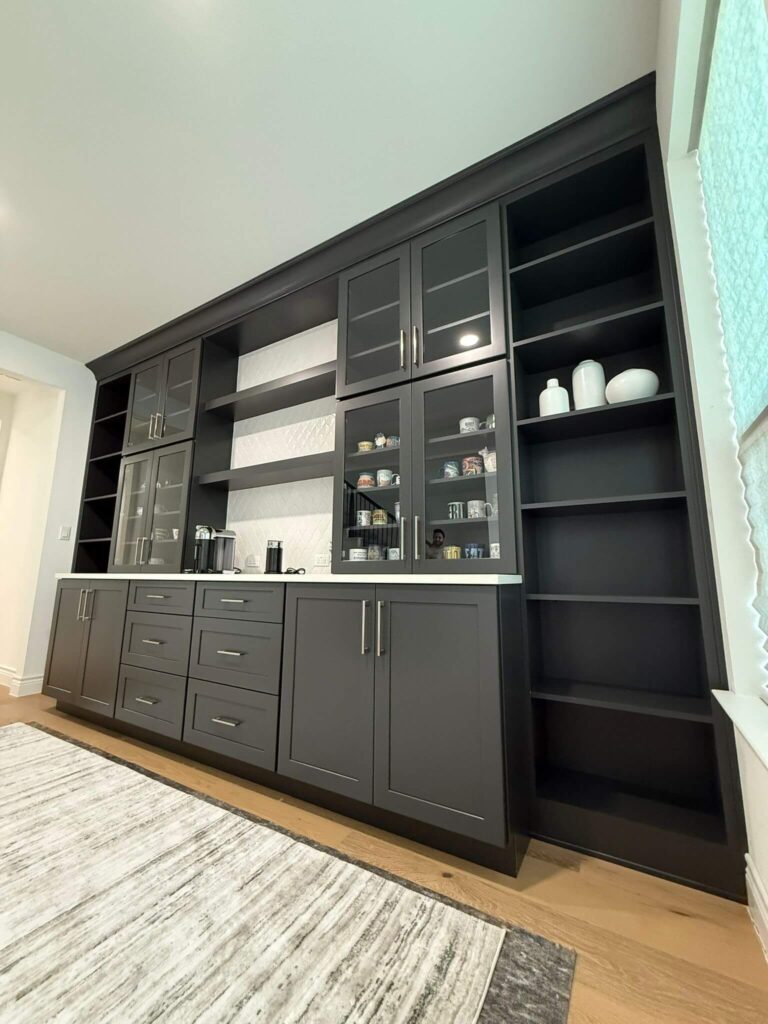 Fabuwood Graphite Galaxy on the main kitchen run, Durasupreme Black Paint on select pieces