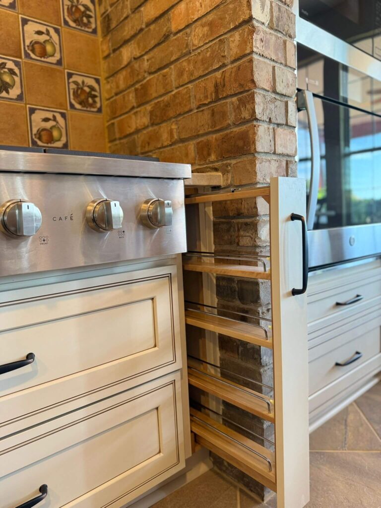 RTA Pearl Glazed Shaker on the perimeter, Durasupreme Knotty Alder on the island and coffee area, Taj Mahal quartzite countertops throughout