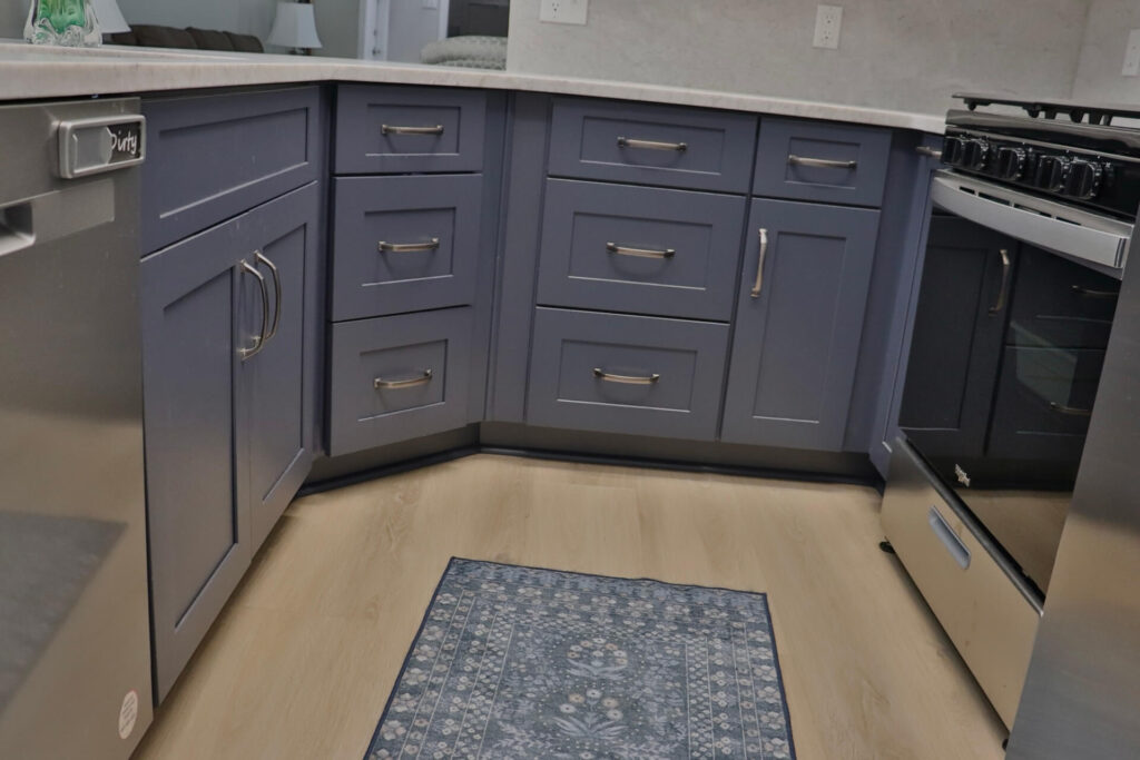 RTA Blue Shaker base cabinets, RTA White Shaker uppers in the kitchen