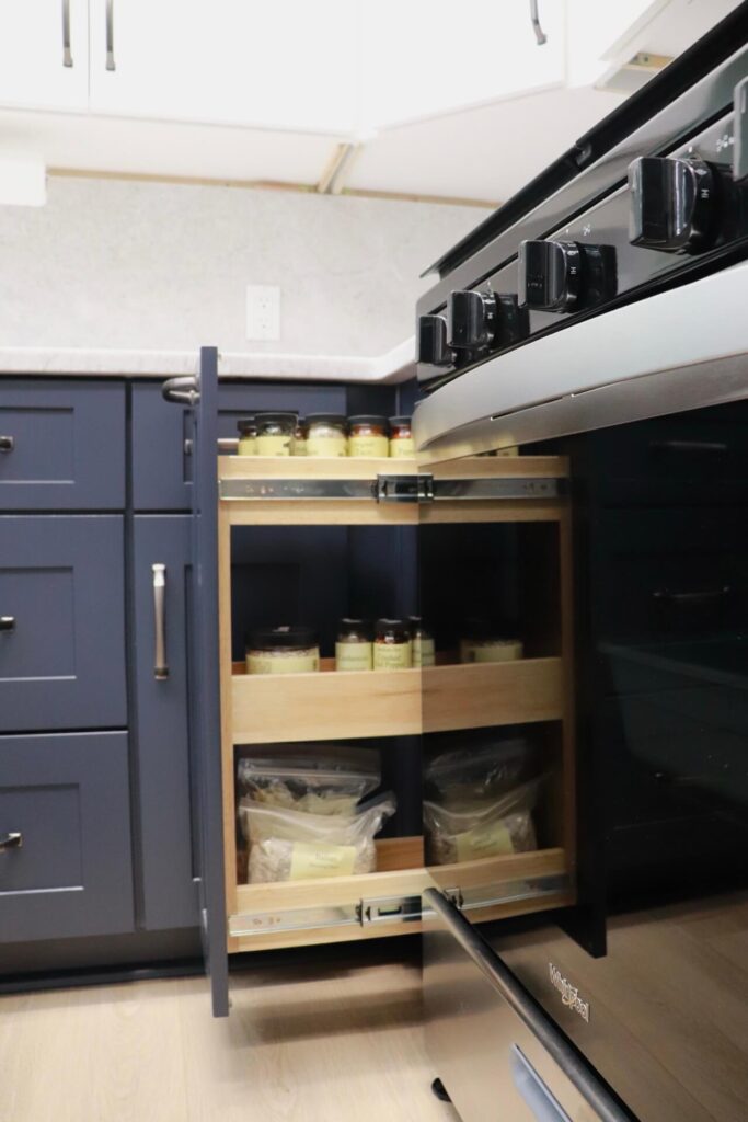 RTA Blue Shaker base cabinets, RTA White Shaker uppers in the kitchen