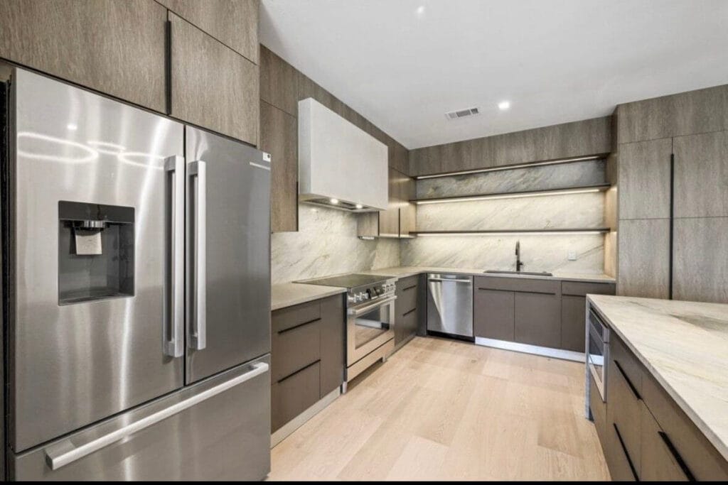 Frameless cabinetry in Salt Oak finish.
