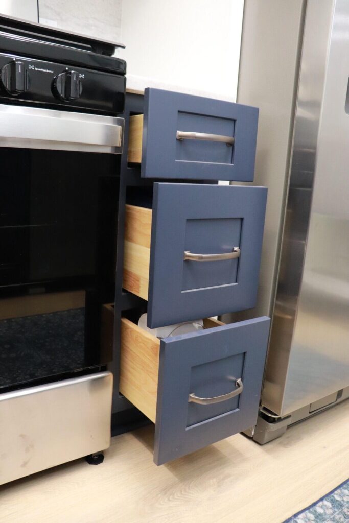 RTA Blue Shaker base cabinets, RTA White Shaker uppers in the kitchen