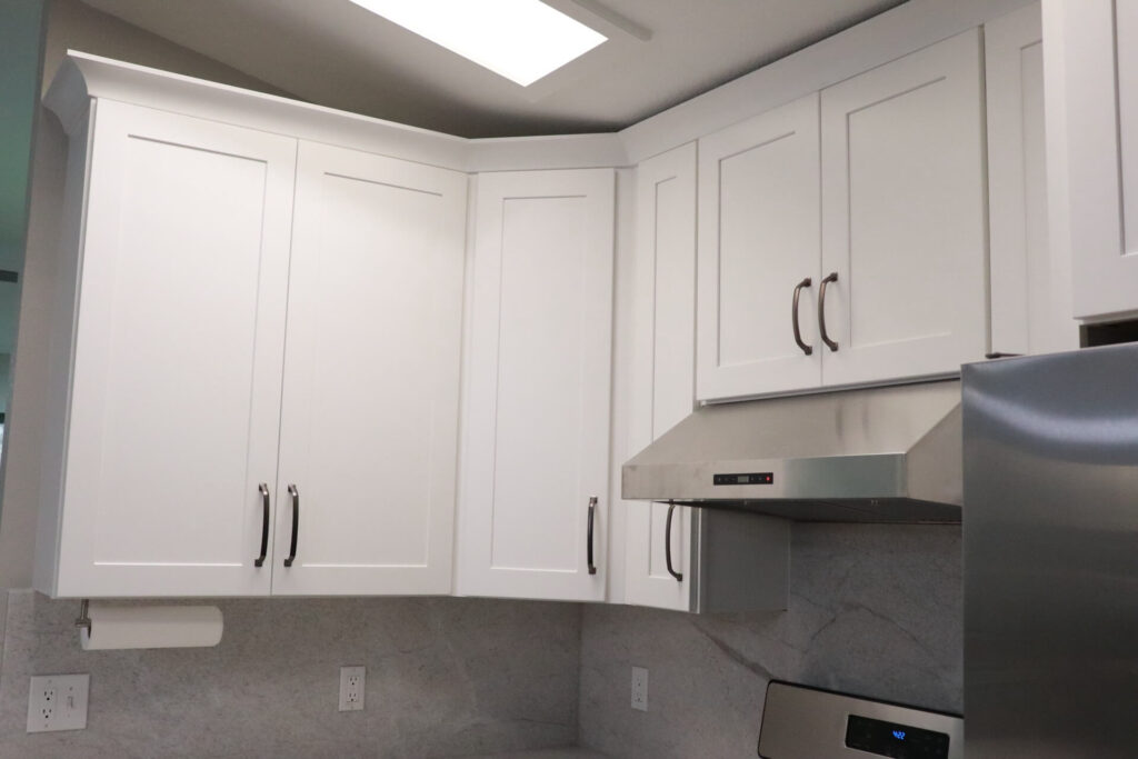 RTA Blue Shaker base cabinets, RTA White Shaker uppers in the kitchen