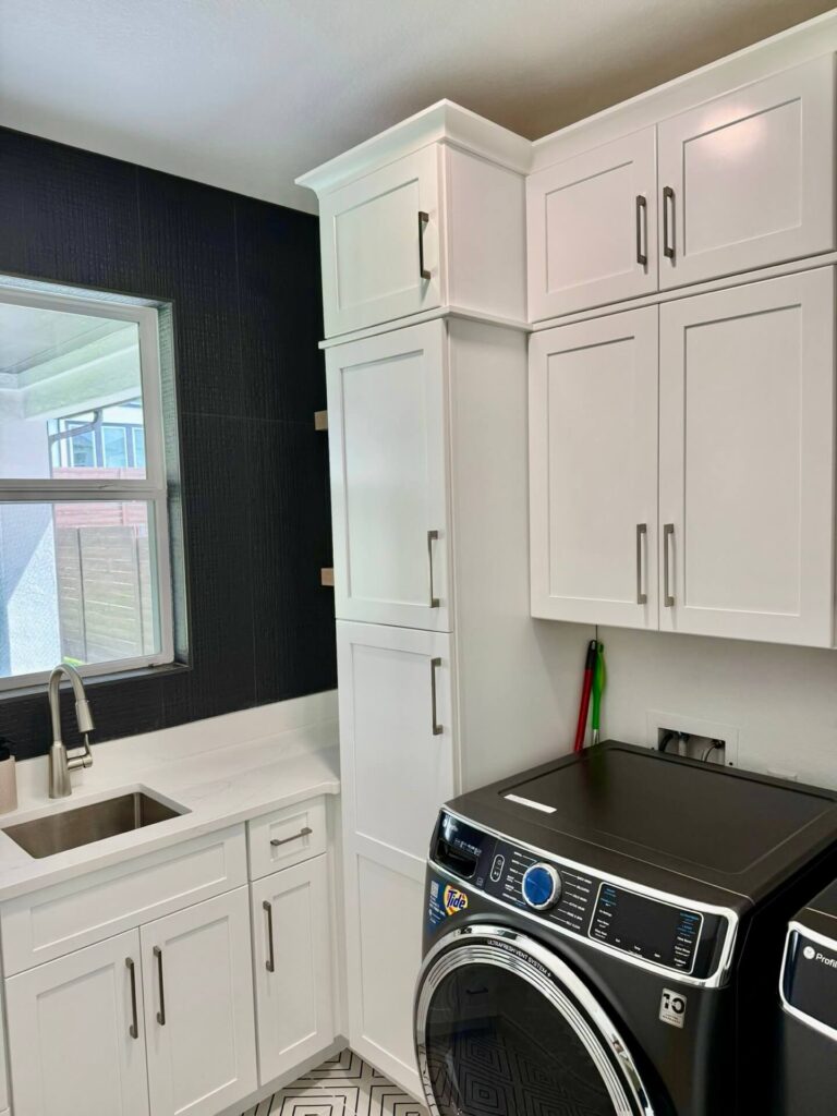 Fabuwood Graphite Galaxy on the main kitchen run, Durasupreme Black Paint on select pieces