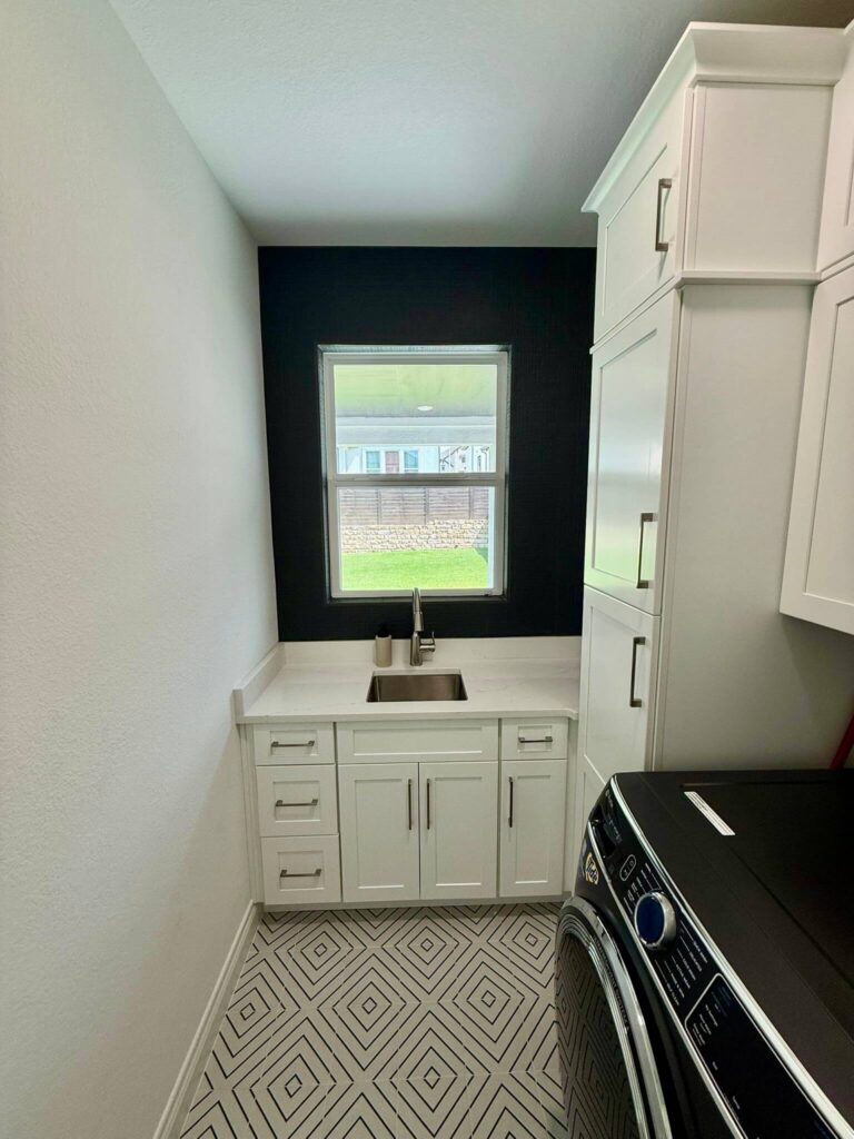 Fabuwood Graphite Galaxy on the main kitchen run, Durasupreme Black Paint on select pieces