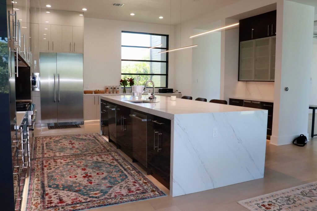 High gloss frameless cabinets in Anthracita and Cashmere kitchen remodeling West Lake Hills