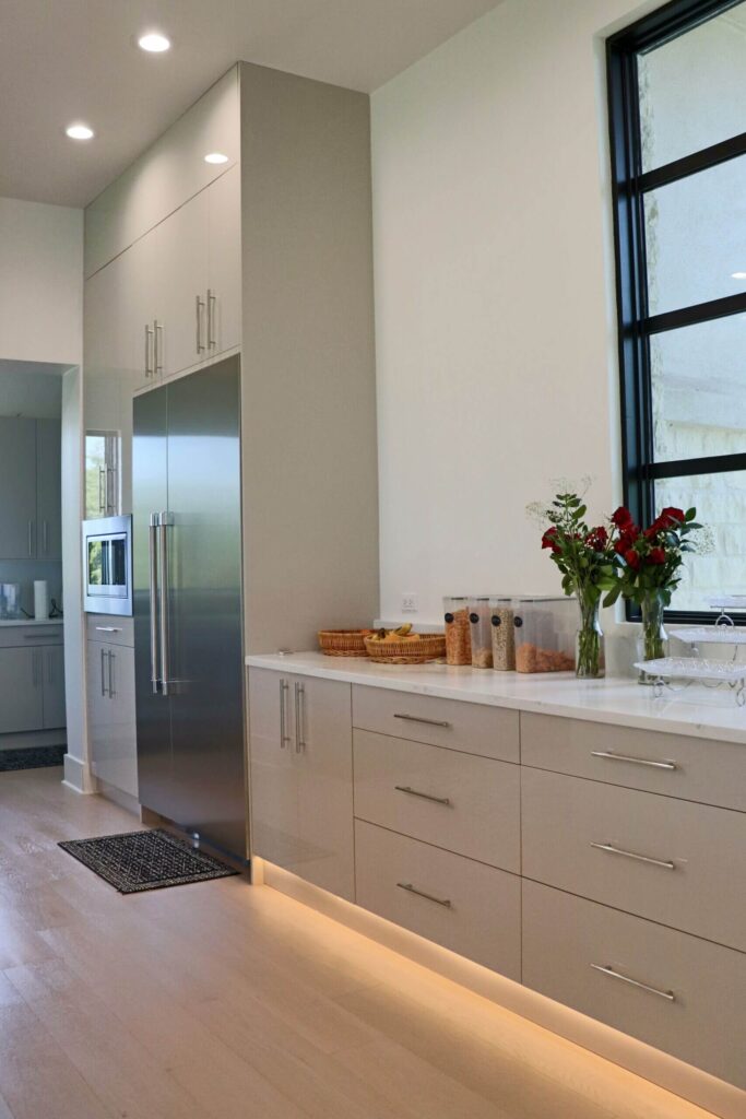 High gloss frameless cabinets in Anthracita and Cashmere kitchen remodeling West Lake Hills