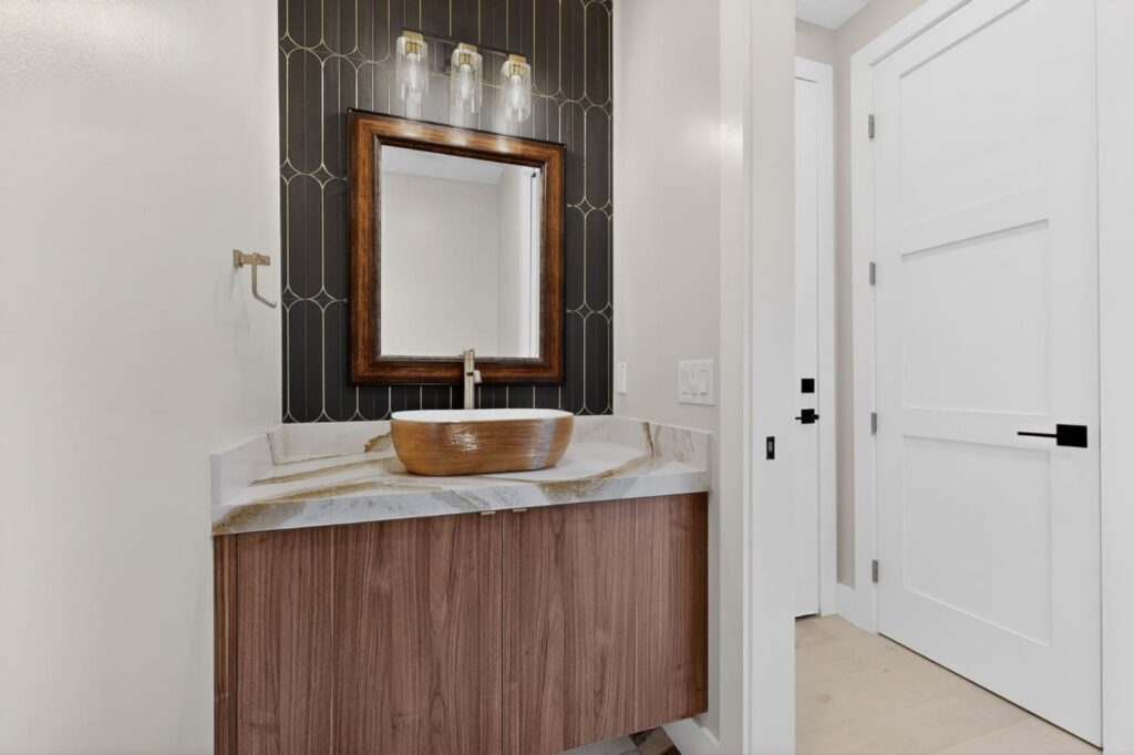 Modern walnut floating vanities in master bathroom by Cabinetto Austin